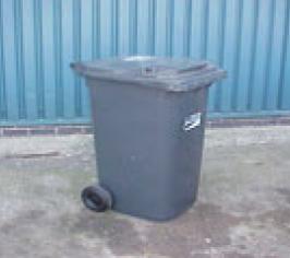 A large grey plastic trade waste bin